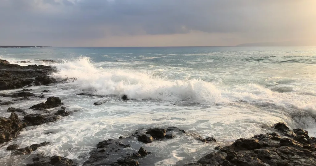 Traveler meditating on a mountain during a spiritual adventure tour