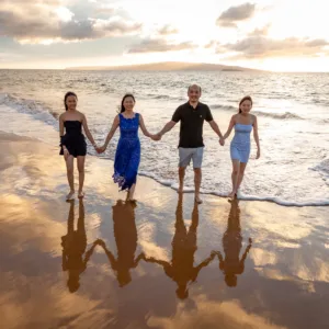 Couple enjoying a romantic sunset with Hawaiian backdrop