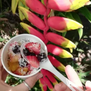 Walkers tasting local foods on Hanapepe food tour