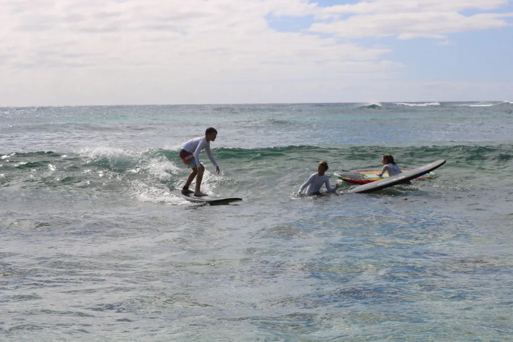 Semi-private surf lesson with instructor helping beginners