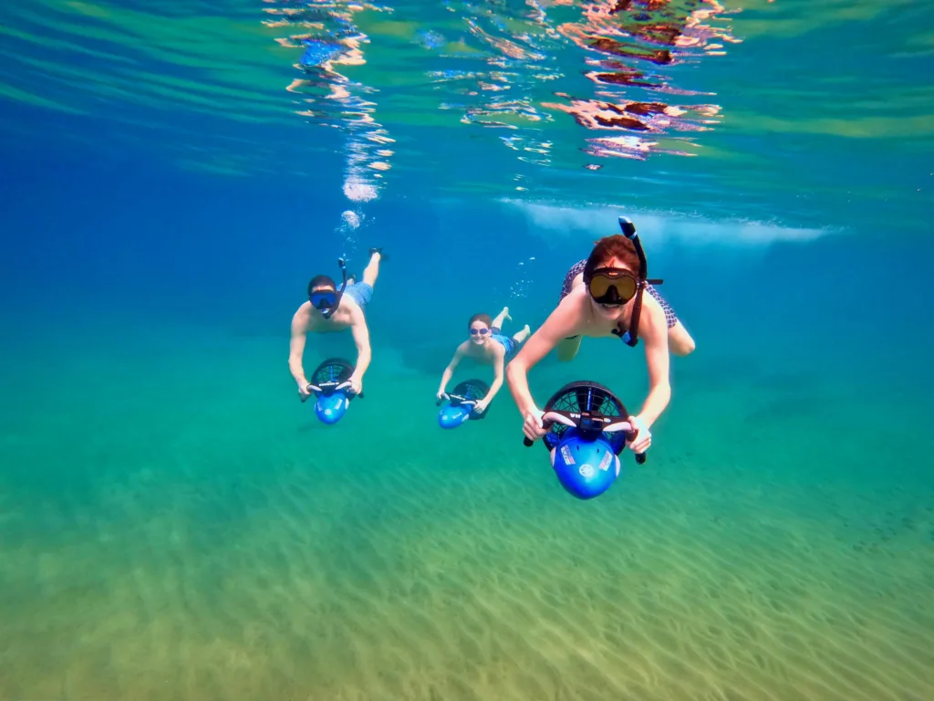 Snorkeler riding sea scooter near Wailea Beach