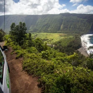 Tour vehicle driving along volcanic landscapes on Big Island