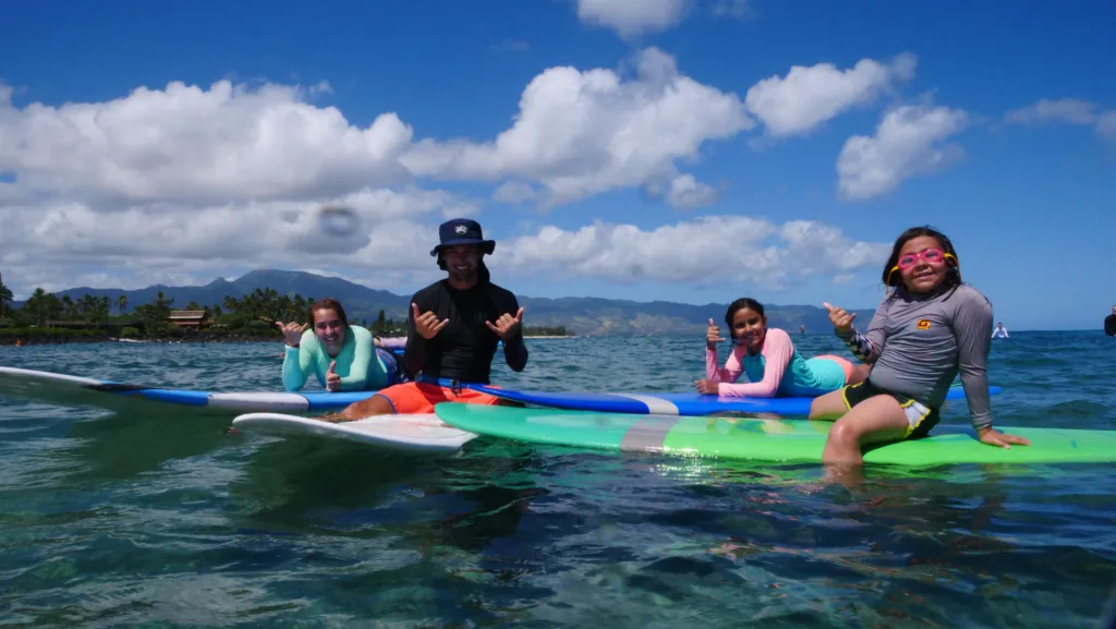 Group of surfers enjoying a private lesson together
