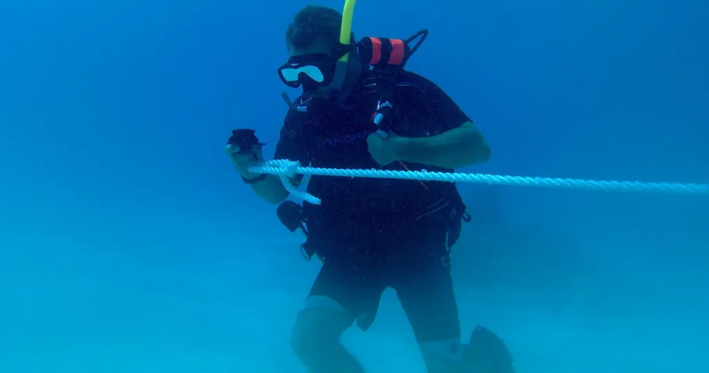 Advanced open water divers exploring deeper ocean areas