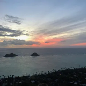 Hiker reaching Lanikai pillboxes at sunrise