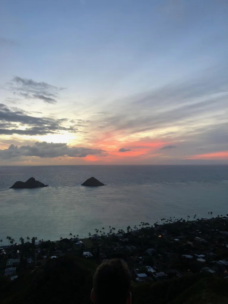 Hiker reaching Lanikai pillboxes at sunrise
