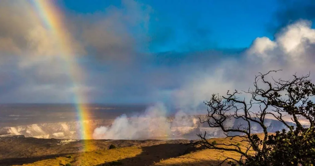 Hikers walking through volcanic landscape in Hawaii park