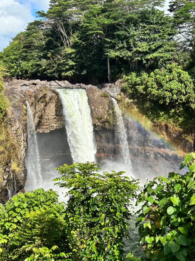 Visitors admiring cascading waterfalls on island tour