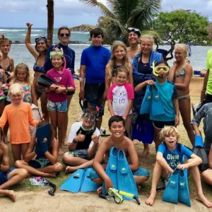 Children exploring colorful coral reefs while snorkeling