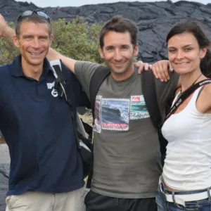 Hiker consulting guide before starting mountain trail hike