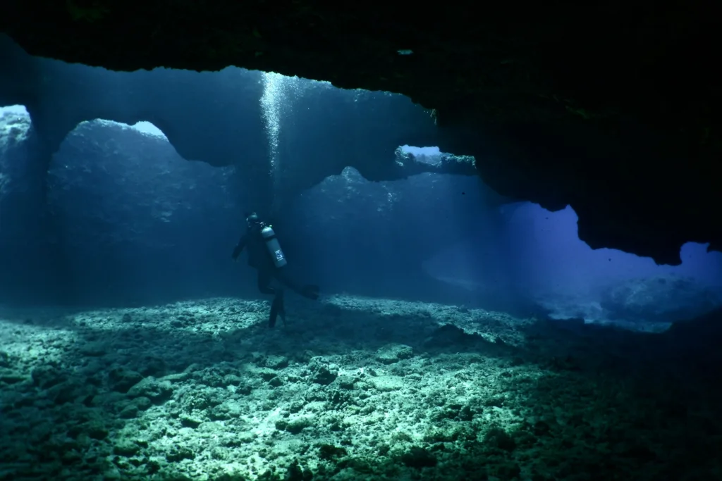 Exploring lava tubes and shipwrecks on Oahu scuba dive