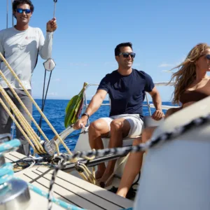 Instructor guiding student during private sailing lesson