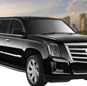 Luxury black Cadillac Escalade parked at airport curb