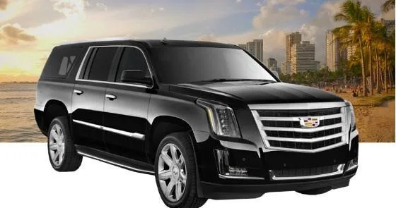 Luxury black Cadillac Escalade parked at airport curb