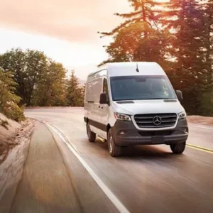 Executive Mercedes van parked outside hotel lobby