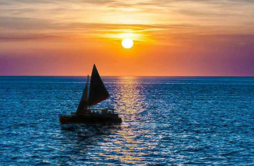 Sailing into the sunset along the Kona coast