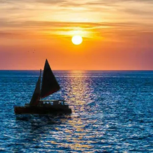 Sailing into the sunset along the Kona coast