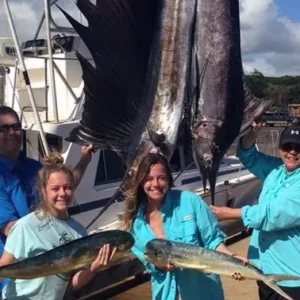Group fishing on a shared charter boat near Kauai