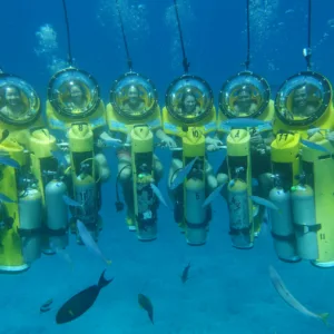 Underwater scooter gliding near colorful coral reefs