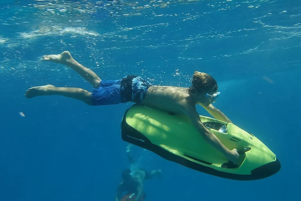 Riding the Seabob and snorkeling in vibrant ocean spots