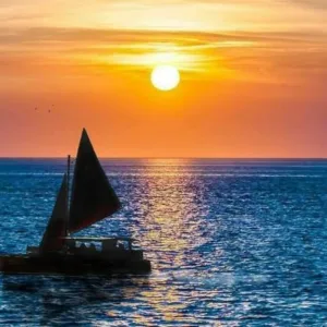 Sunset sailboat cruise along Oahu coastline
