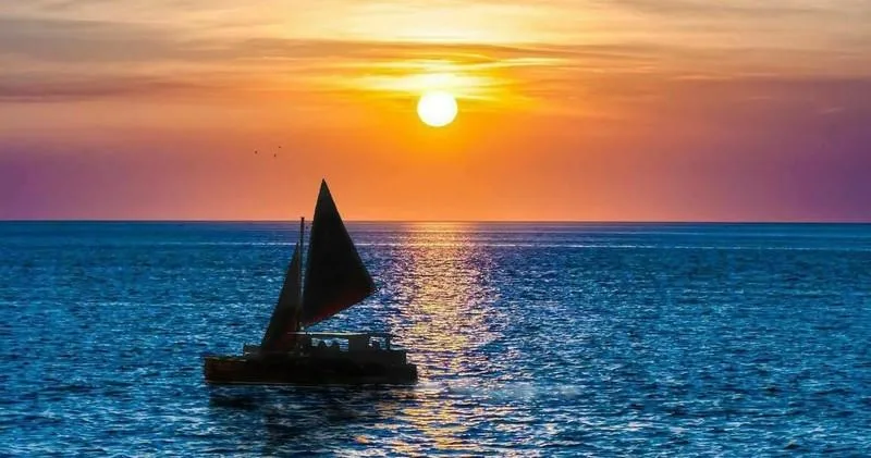 Sunset sailboat cruise along Oahu coastline