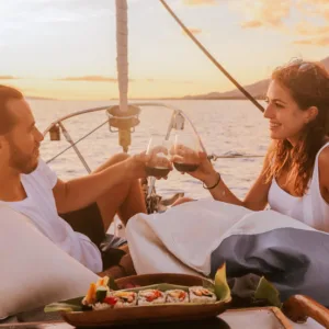 Private monohull boat cruising at sunset on the ocean