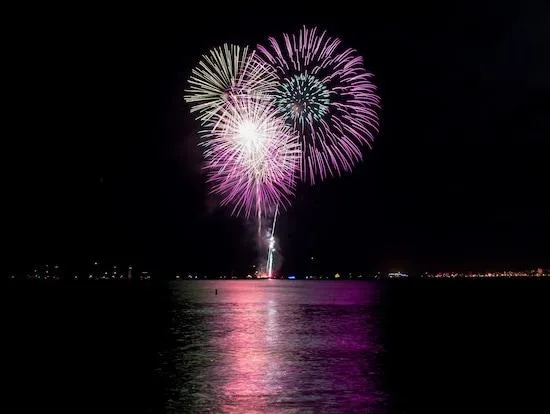 Sunset cruise boat with passengers enjoying BYOB experience