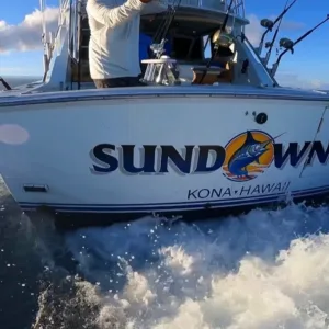 Private charter boat cruising at sunset on island waters