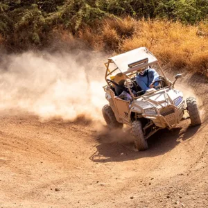 Riders navigating rugged terrain on off-road ATVs