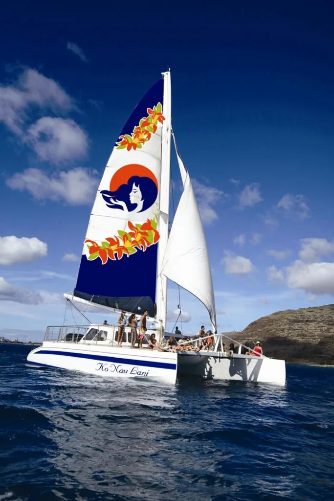 Sail along West Oahu watching dolphins and snorkeling with turtles