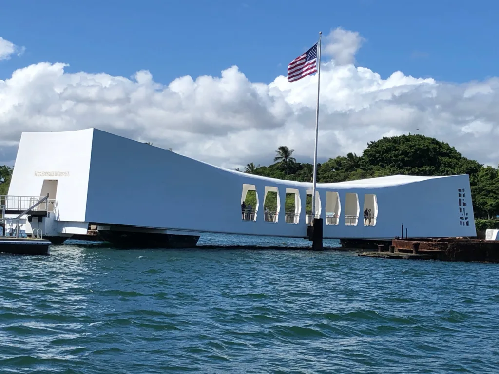 Visitors exploring historic Arizona Memorial site outdoors