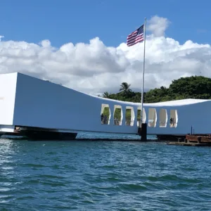 Visitors exploring historic Arizona Memorial site outdoors