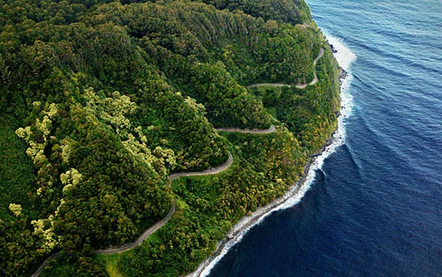 Adventure vehicle driving along lush Road to Hana