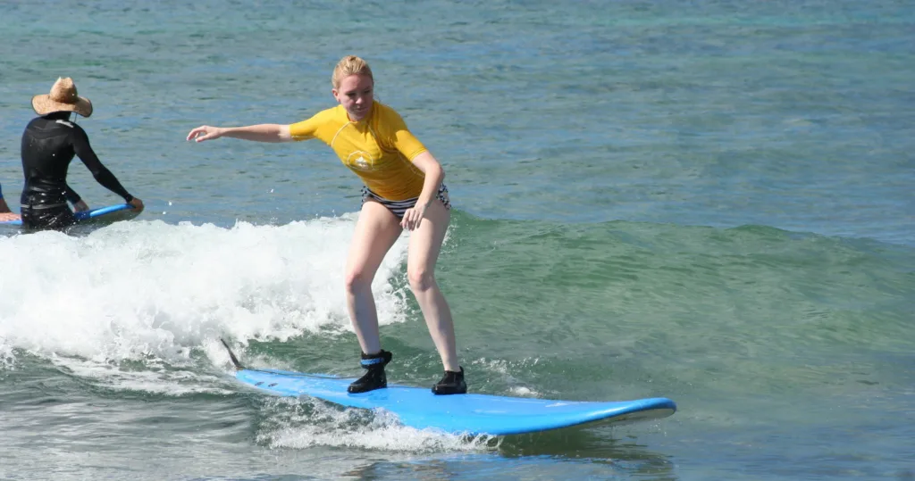 Personalized surfing lesson on gentle island waves