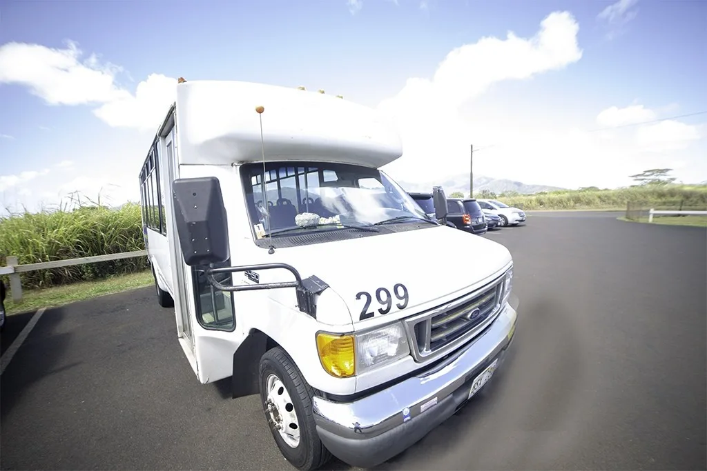 Private van driving along Oahu coastal road