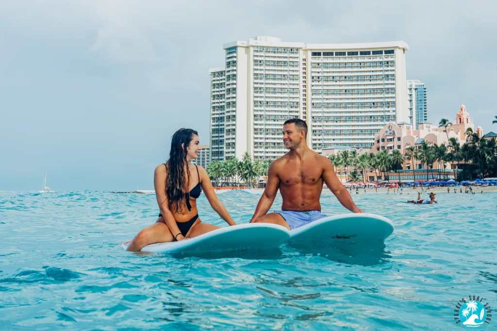 Couple enjoying a private surfing lesson together
