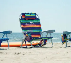 Comfortable beach chair set up facing ocean waves
