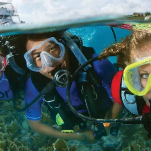 Student studying scuba diving theory on laptop