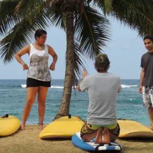 Group surf lesson with instructor guiding beginners