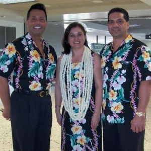 Welcoming guests with traditional lei greeting at Hilo airport