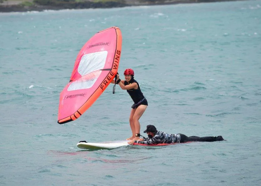 Windsurfer practicing skills during multi-day wing-surfing course