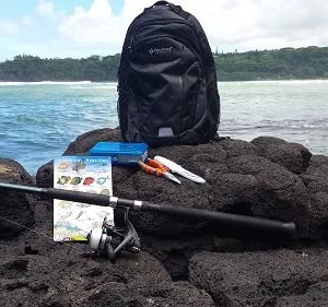 Hiker preparing gear for mountain trail