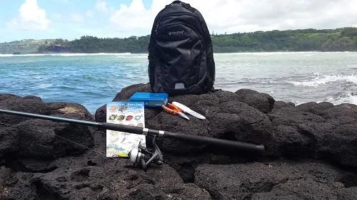 Hiker preparing gear for mountain trail