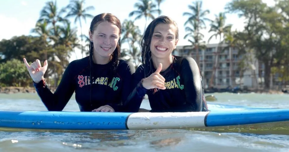 Group surf lessons teaching fundamentals on Maui shores
