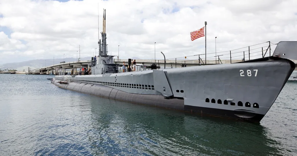 Visitors exploring Pearl Harbor on a deluxe tour with lunch