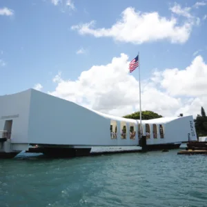 Historic Arizona Memorial at Pearl Harbor under blue sky
