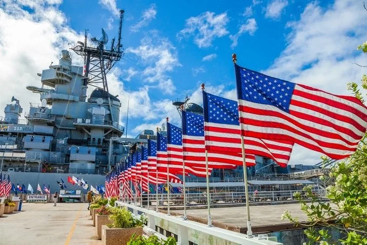 Historic Pearl Harbor memorial with battleship in background