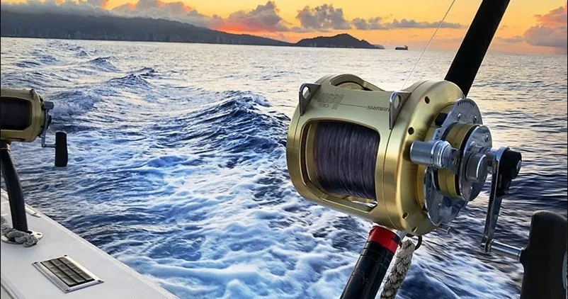 Private boat cruising along Oahu's coastline