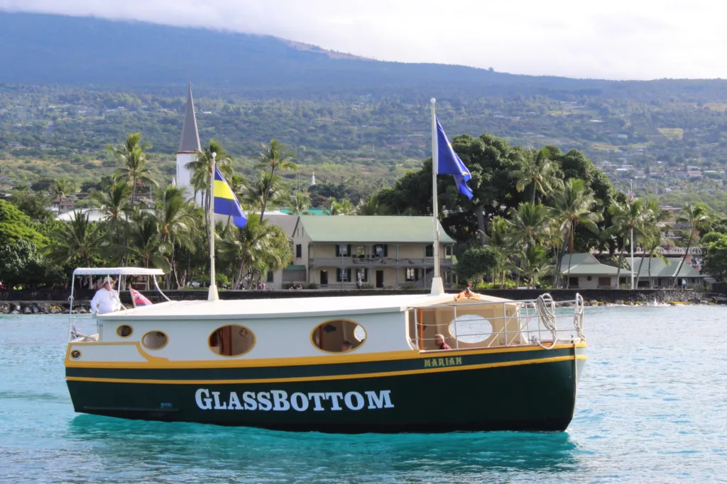 Glass bottom boat revealing vibrant coral reefs below